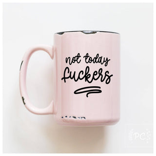 Pink mug with black text 'not today Fuckers' on a white background