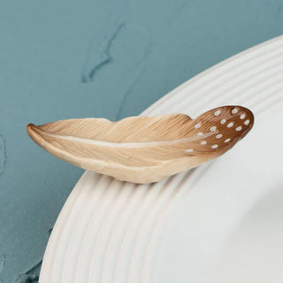 Wooden bowl with a textured surface on a textured surface with a blue background