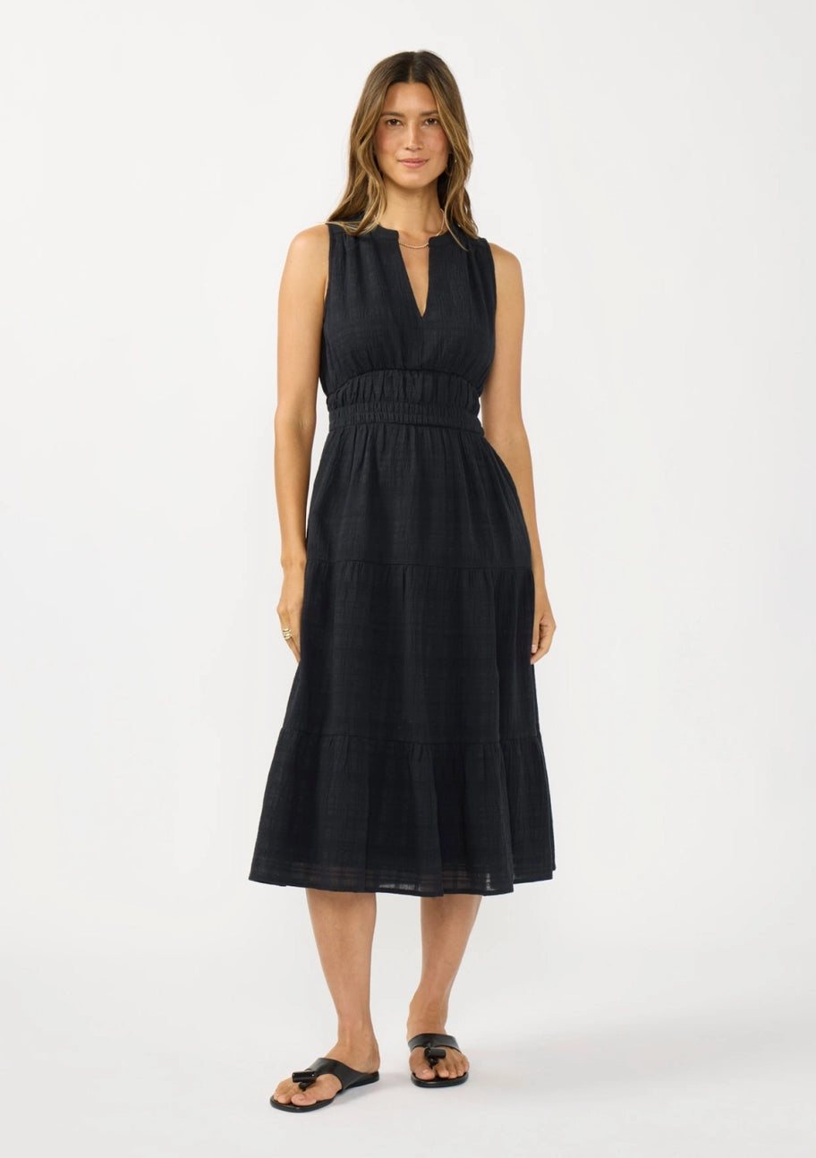 Woman wearing a black dress on a white background