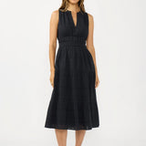 Woman wearing a black dress on a white background