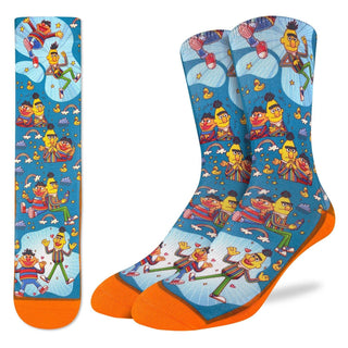 Colorful socks with Sesame Street character design on a blue background