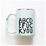 Mug with text 'ABCDE FUC KYOU' on a white background