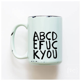Mug with text 'ABCDE FUC KYOU' on a white background