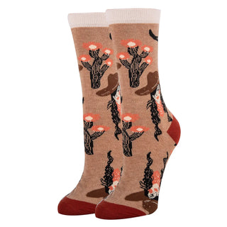 Pair of socks with cactus design on a beige background