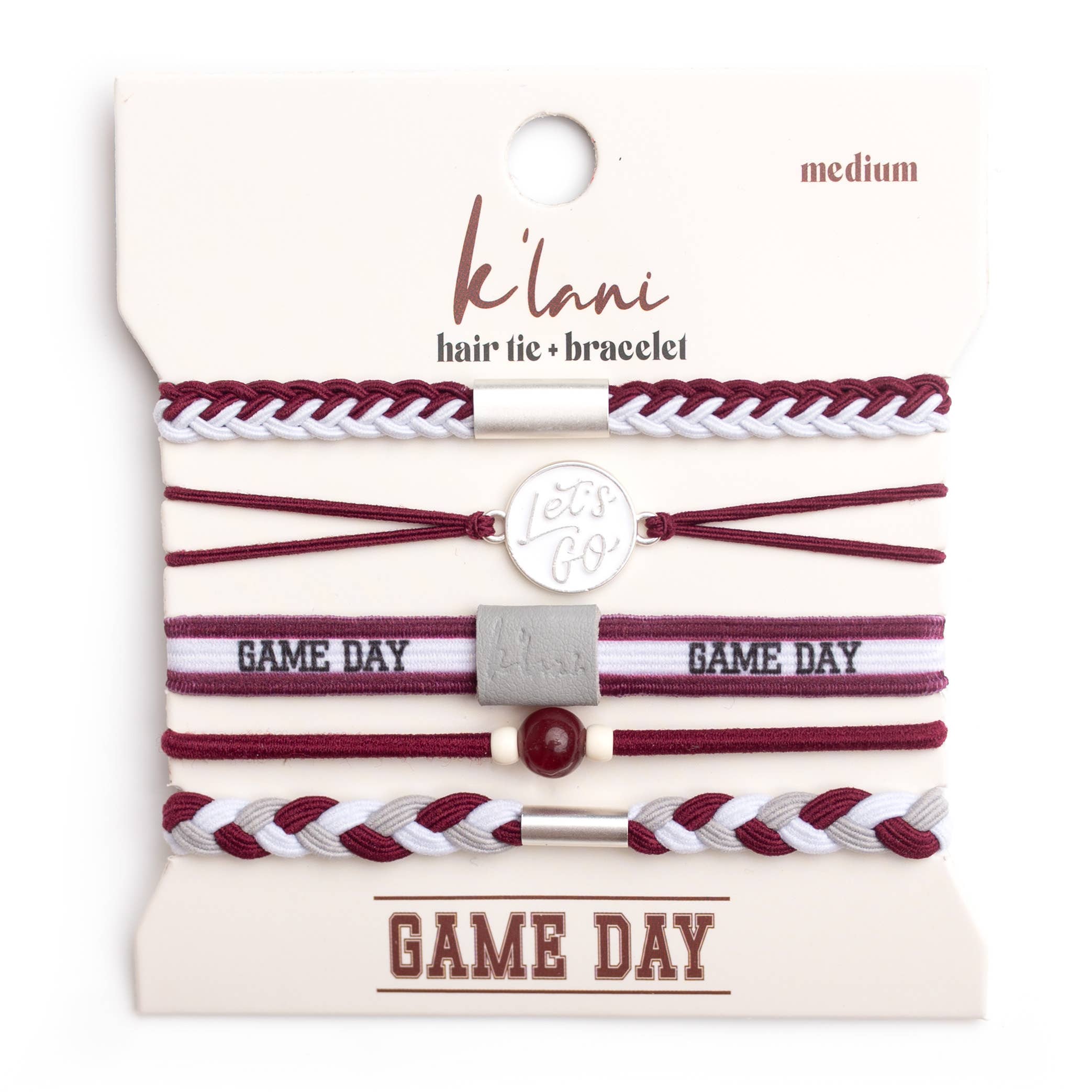 Set of maroon and white hair ties and bracelets on a 'klani' branded card.