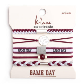 Set of maroon and white hair ties and bracelets on a 'klani' branded card.