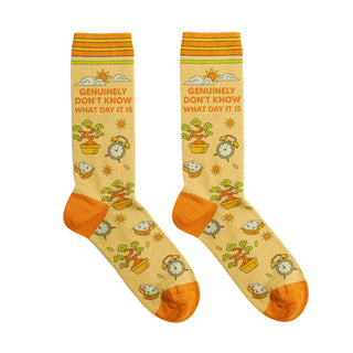 Two socks with a cartoon design on a beige background
