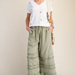SAGE PANTS with model in sneakers