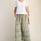 SAGE PANTS with model in sneakers