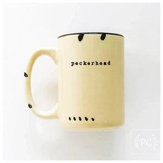 Beige mug with 'peckerhead' text on a white background