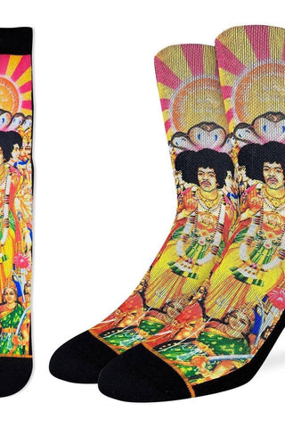 Colorful socks with a graphic design of a person in a vibrant outfit on a white background