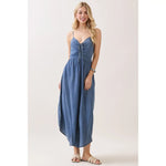 Woman wearing a blue denim dress on a white background