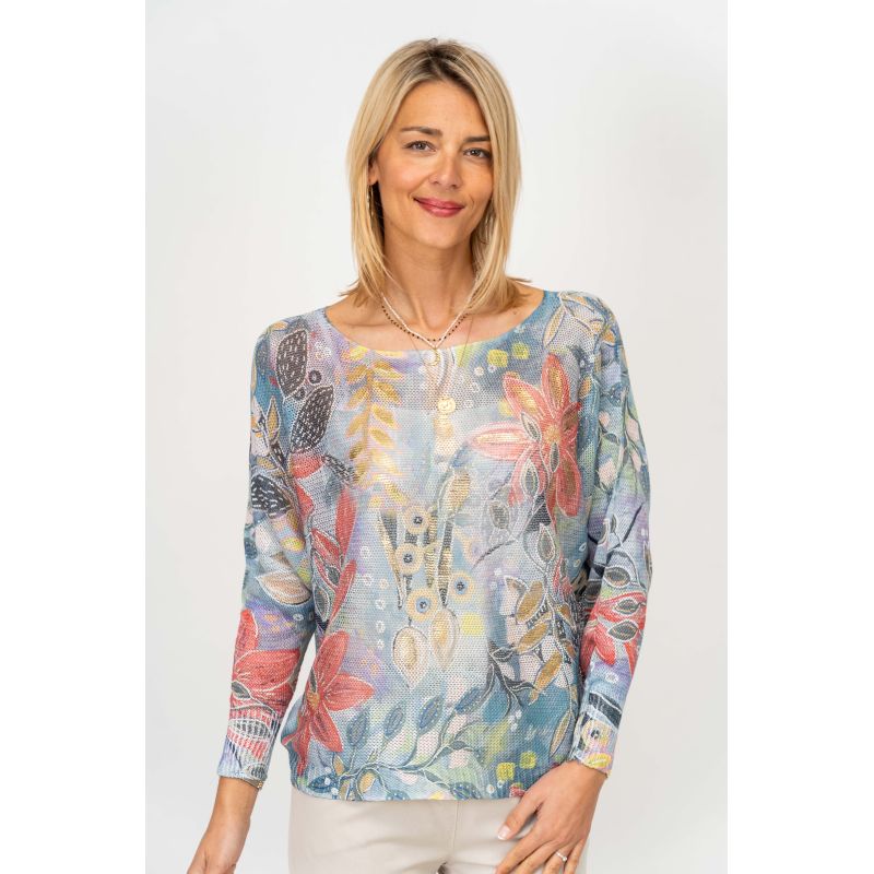 Woman wearing a floral patterned blouse on a white background