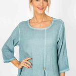 Woman wearing a light blue outfit on a white background
