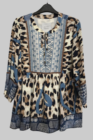 Leopard print dress with blue accents on a hanger against a gray background