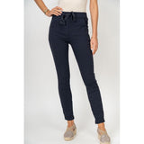 Navy blue pants worn by a person on a white background