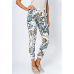 Floral patterned pants worn by a person on a white background