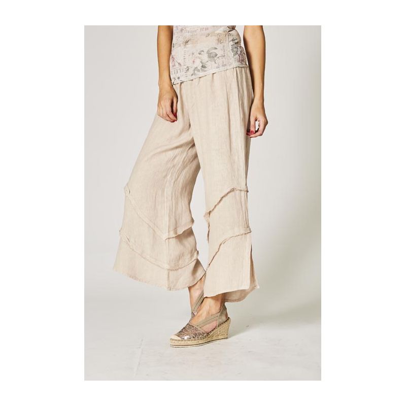 Beige wide-leg pants worn by a person on a plain background