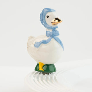 Decorative duck figurine with a blue hood and green feet on a white background