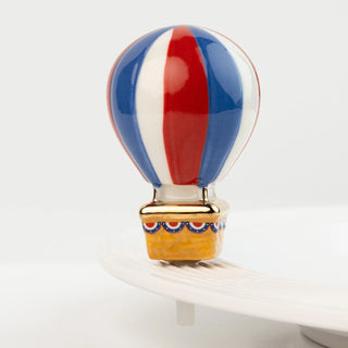 Decorative hot air balloon with red, white, and blue colors on a white background