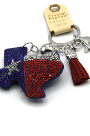 Keychain with Texas-shaped design, red and blue colors, and tassel on a white background.