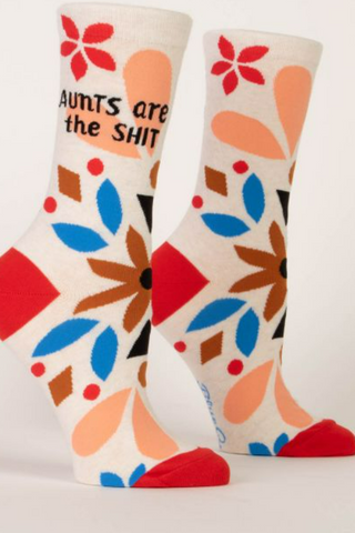 Colorful socks with geometric patterns and text on a white background