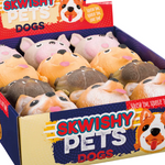 A box of Skwishy Pets Dogs toys, featuring a variety of plush dog figures in different colors.