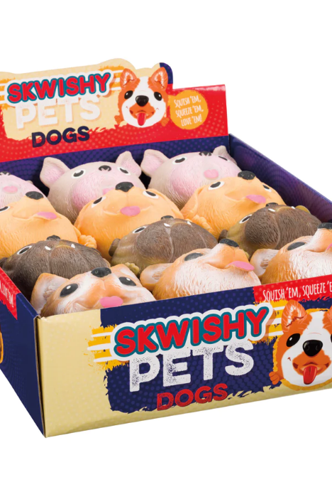A box of Skwishy Pets Dogs toys, featuring a variety of plush dog figures in different colors.